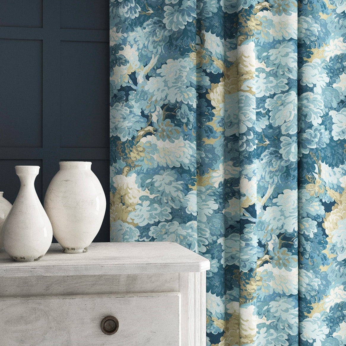 Curtain made from a printed velvet fabric featuring a classic oak leaf design in Cornflower.
