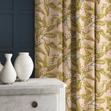 Velvet curtains in a peach and ochre leaf and blossom design.