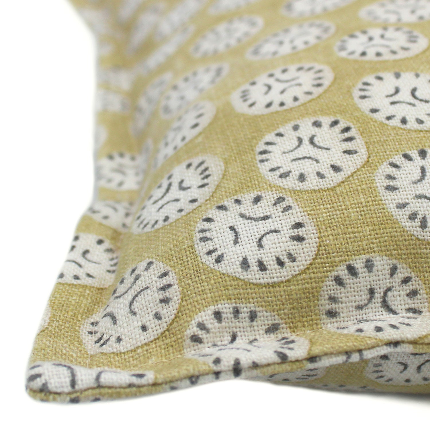A yellow, cream and black linen cushion with a all-over repeat pattern.