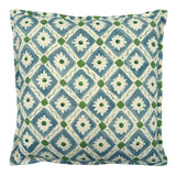 Decorative cushion with a geometric floral pattern in blue and green.