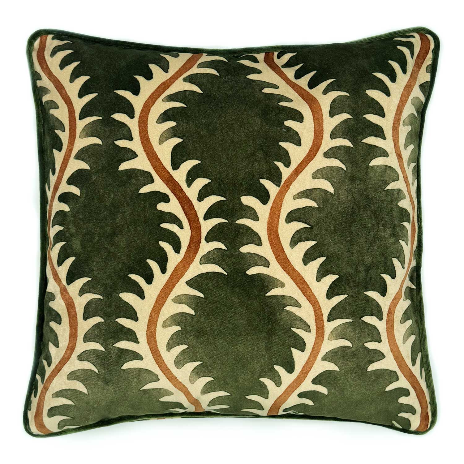 A green, orange and off white velvet cushion with a all-over repeat pattern and velvet piping.