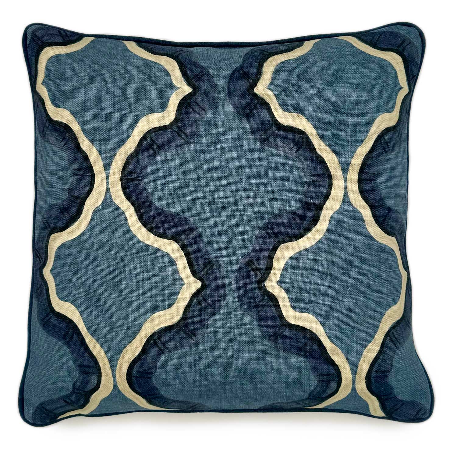 A blue and off white linen cushion featuring a mirrored ribbon pattern with a velvet piping.