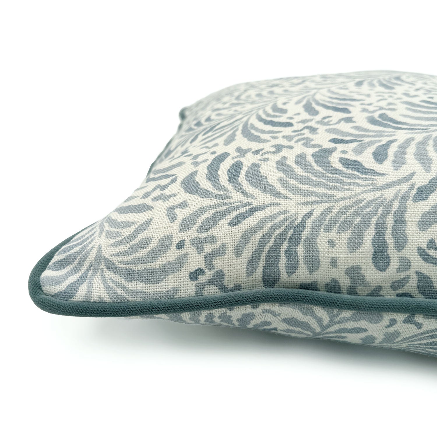 Close-up side view of Linwood cushion in Blythe, Soft Blue showing fabric texture and piping in a complementary blue linen.