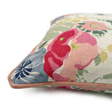 Close-up side view of Linwood cushion in Joni, Raspberry showing fabric texture and piping in a complementary soft pink linen.