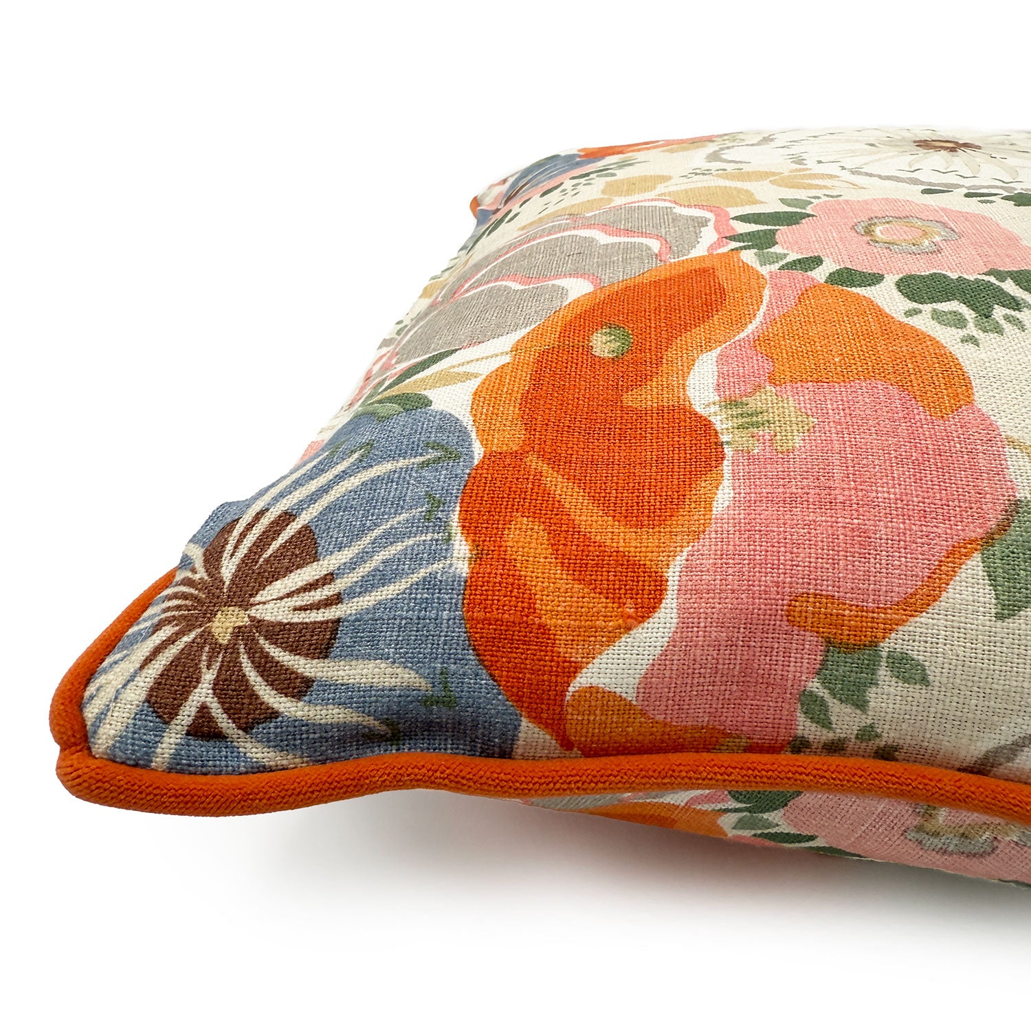 Close-up side view of Linwood cushion in Joni, Tangerine showing fabric texture and piping in a complementary deep orange linen.