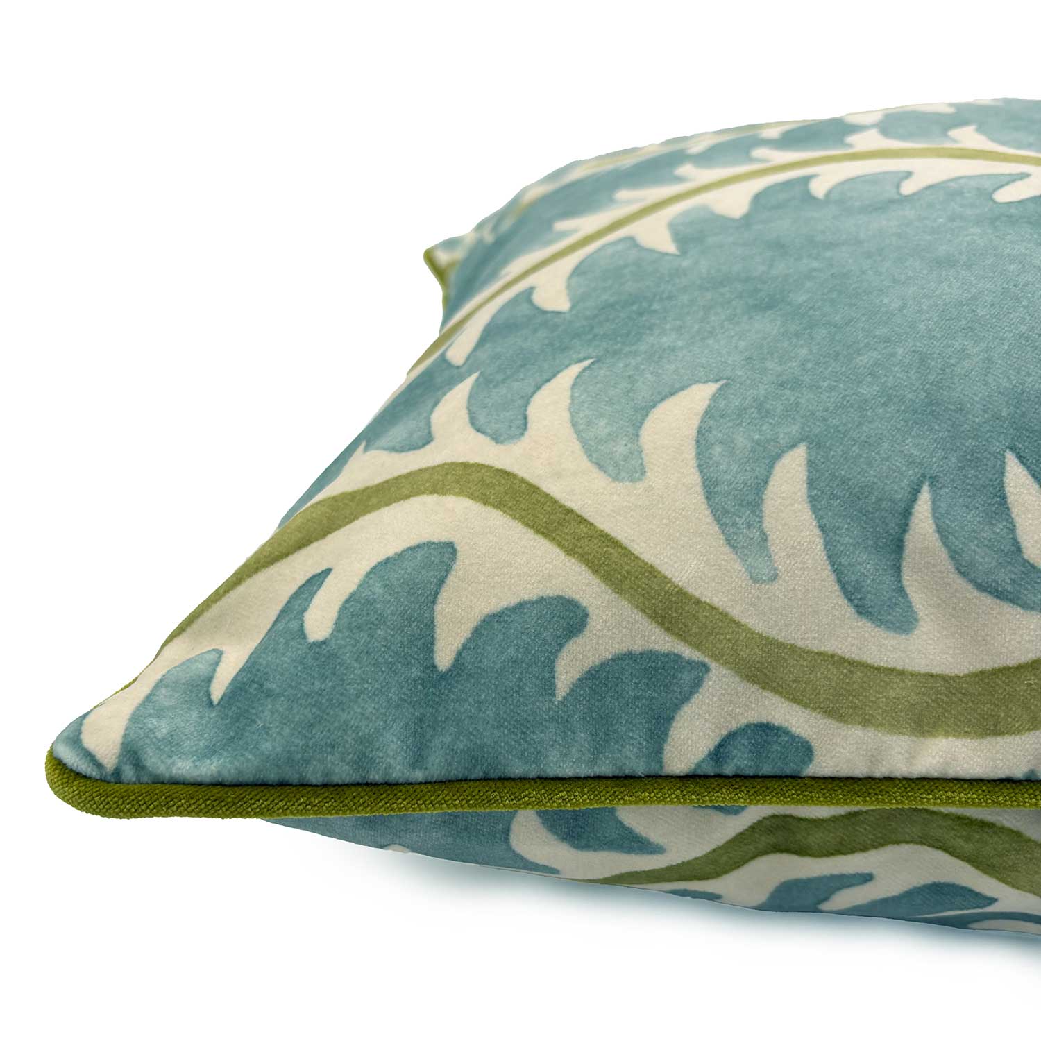 Blue velvet cushion with a stylised fern pattern. 