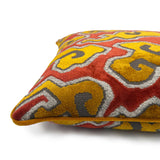 Close-up side view of Linwood cushion in Kumo Flame, showing the fabric texture and velvet piping detail.
