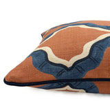 Blue and terracotta linen cushion with a mirrored ribbon pattern.