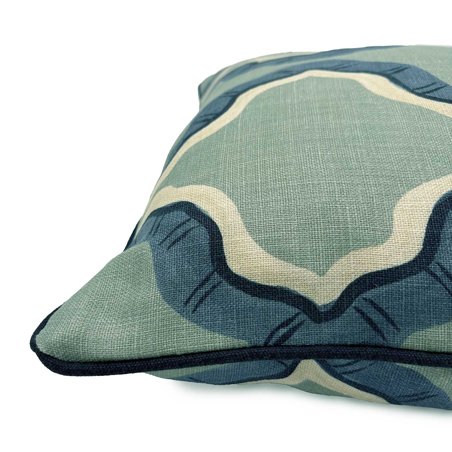 Blue and green linen cushion with a mirrored ribbon pattern.