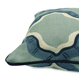 Blue and green linen cushion with a mirrored ribbon pattern.