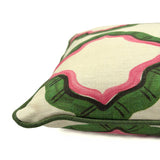 Pink and green cushion with a ribbon pattern