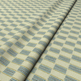 Strata fabric in Bluestone, styled in a wave to show horizontal structure and depth.