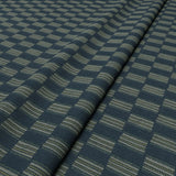 Strata fabric in Denim, styled in a wave to show horizontal structure and depth.
