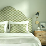 Bedroom with upholstered headboard and cushions in Tidal fabric showing soft texture.
