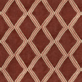Close-up of red and pink printed velvet fabric featuring an irregular diamond motif with a soft, luxurious pile. 