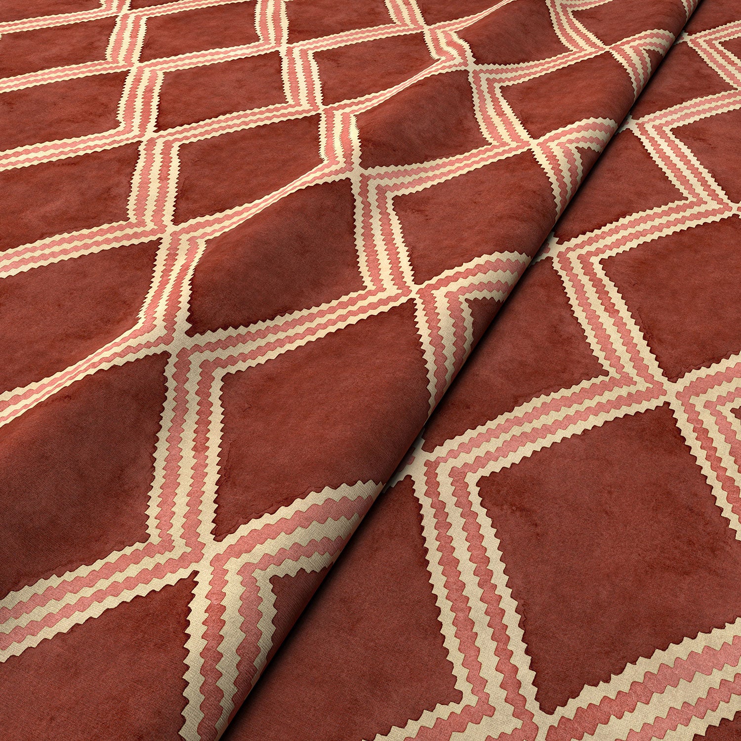 Close-up of red and pink printed velvet fabric featuring an irregular diamond motif with a soft, luxurious pile. 