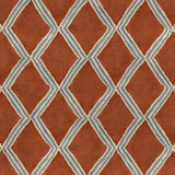 Close-up of red and blue printed velvet fabric featuring an irregular diamond motif with a soft, luxurious pile. 