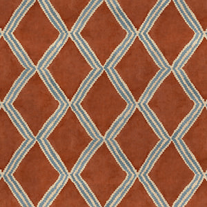 Close-up of red and blue printed velvet fabric featuring an irregular diamond motif with a soft, luxurious pile. 