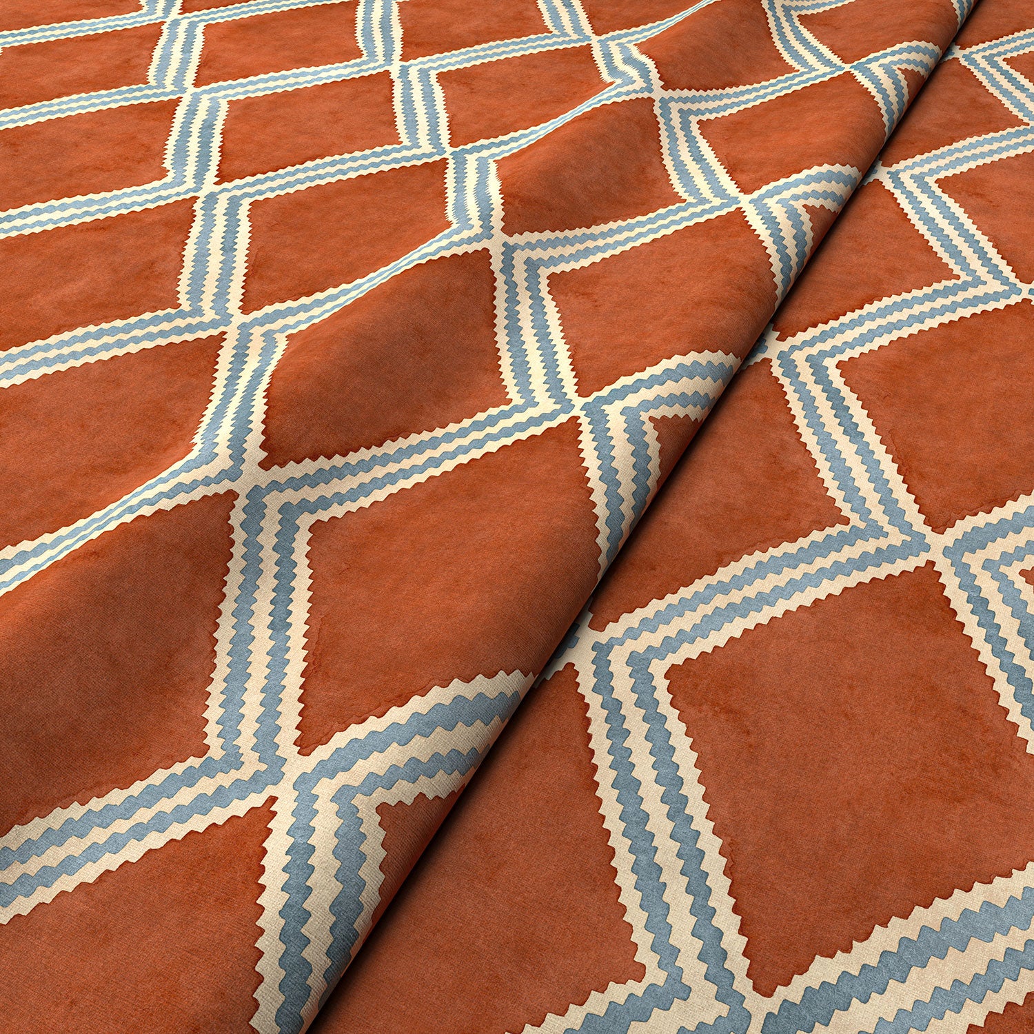 Close-up of red and blue printed velvet fabric featuring an irregular diamond motif with a soft, luxurious pile. 