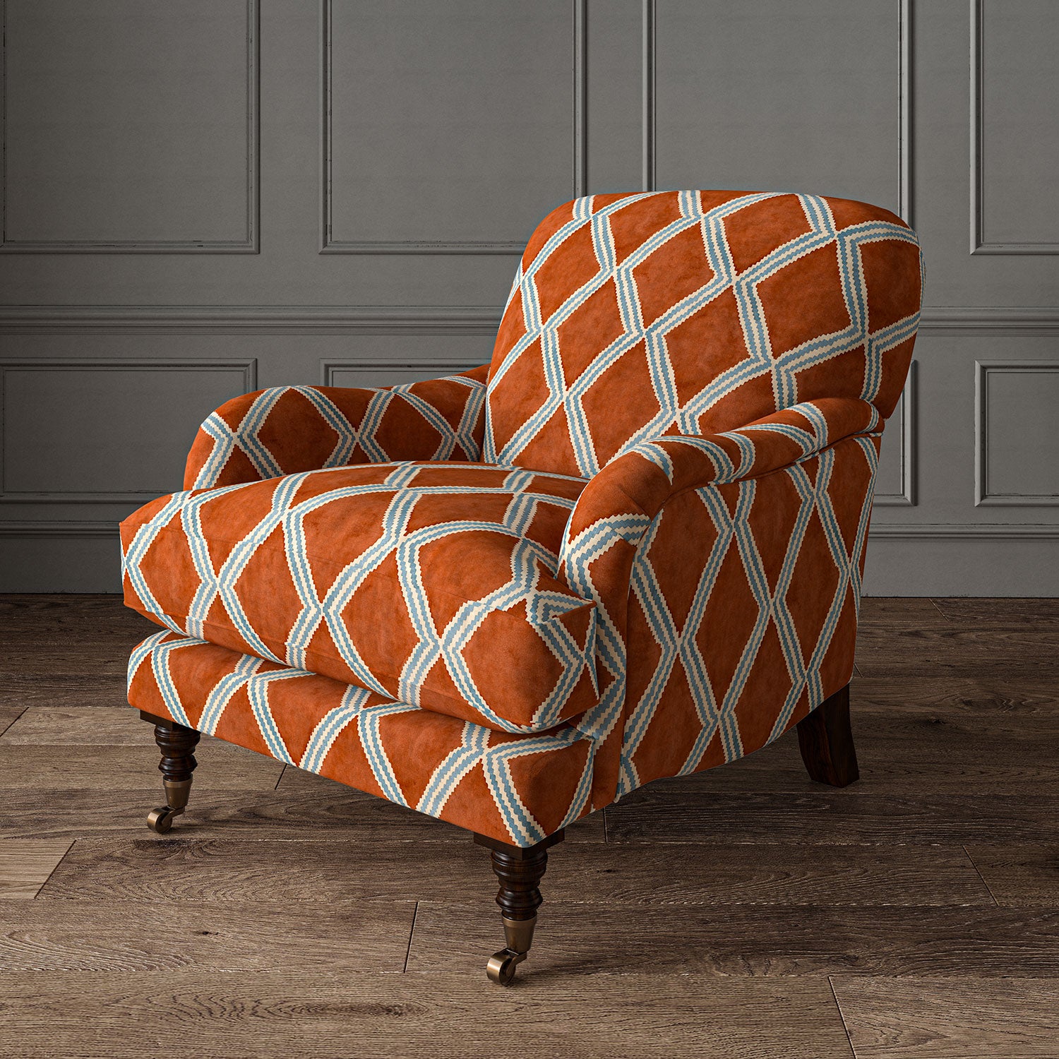 Accent chair upholstered in red and blue printed velvet with an irregular diamond pattern, showcasing the fabric’s rich texture. 