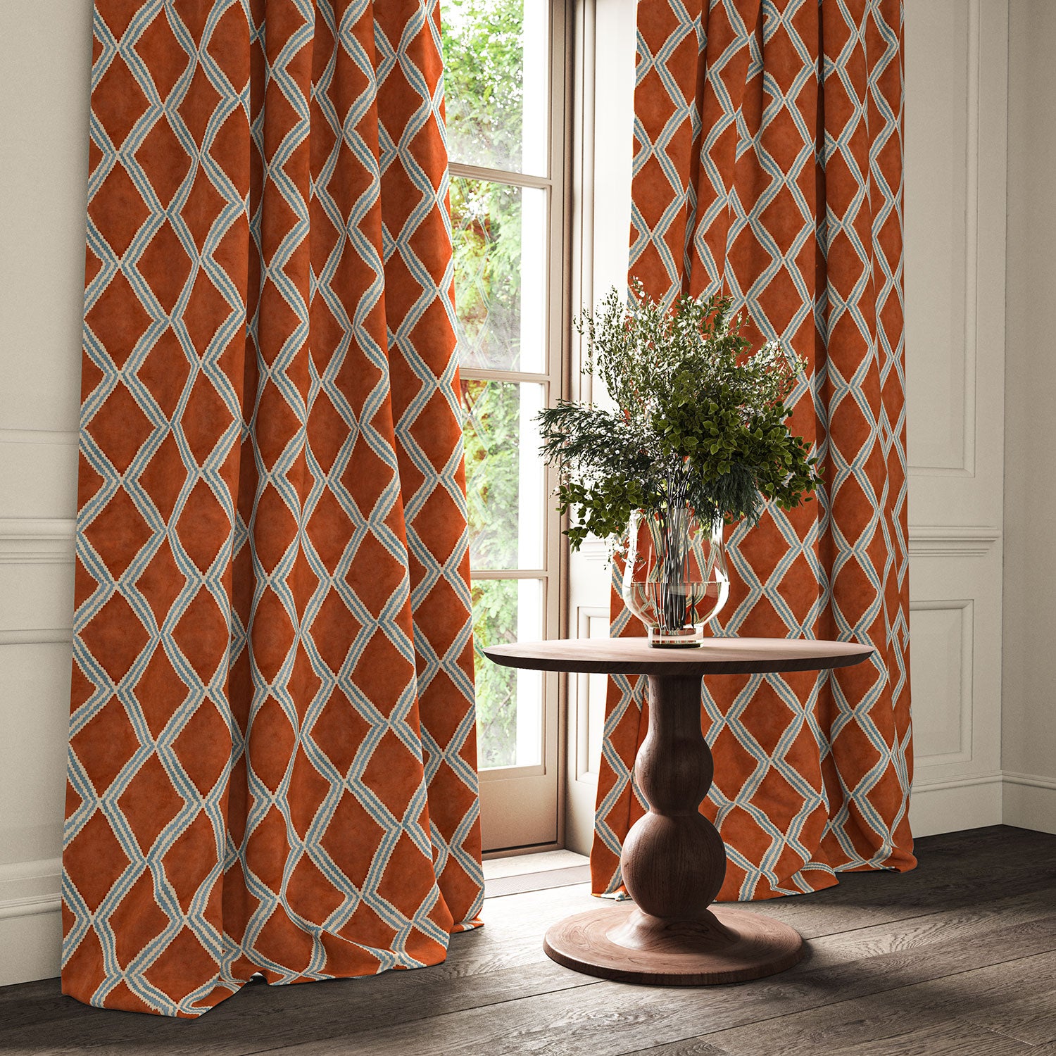 Red and blue printed velvet curtains with an irregular diamond pattern framing a tall window.