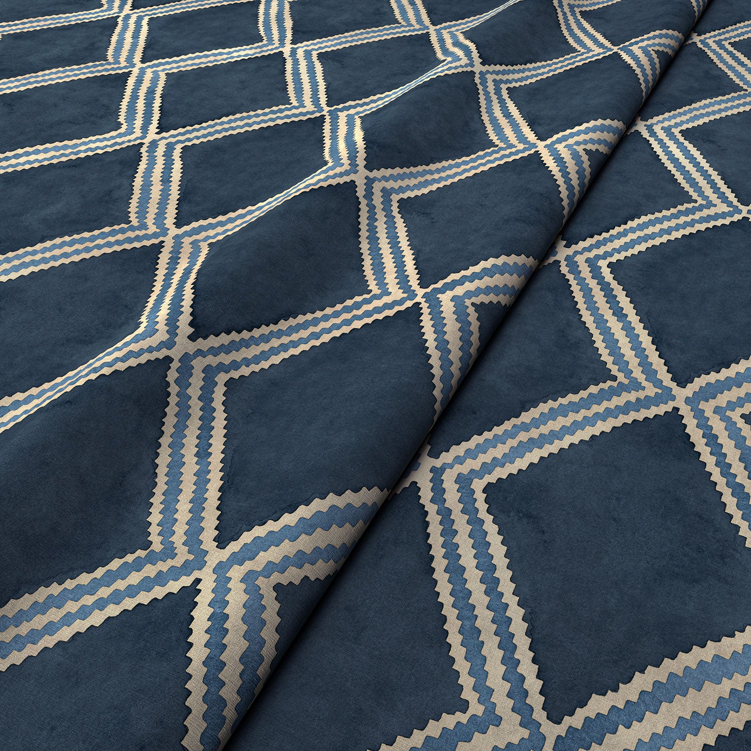 Close-up of blue printed velvet fabric featuring an irregular diamond motif with a soft, luxurious pile. 