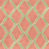 Close-up of orange and green printed velvet fabric featuring an irregular diamond motif with a soft, luxurious pile. 