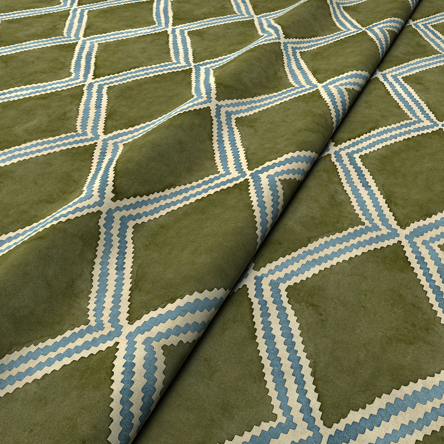 Close-up of green and blue printed velvet fabric featuring an irregular diamond motif with a soft, luxurious pile. 