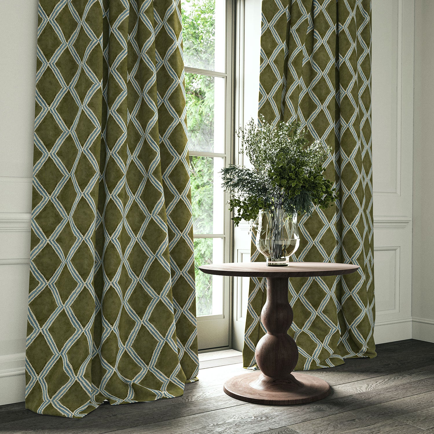 Green and blue printed velvet curtains with an irregular diamond pattern framing a tall window.
