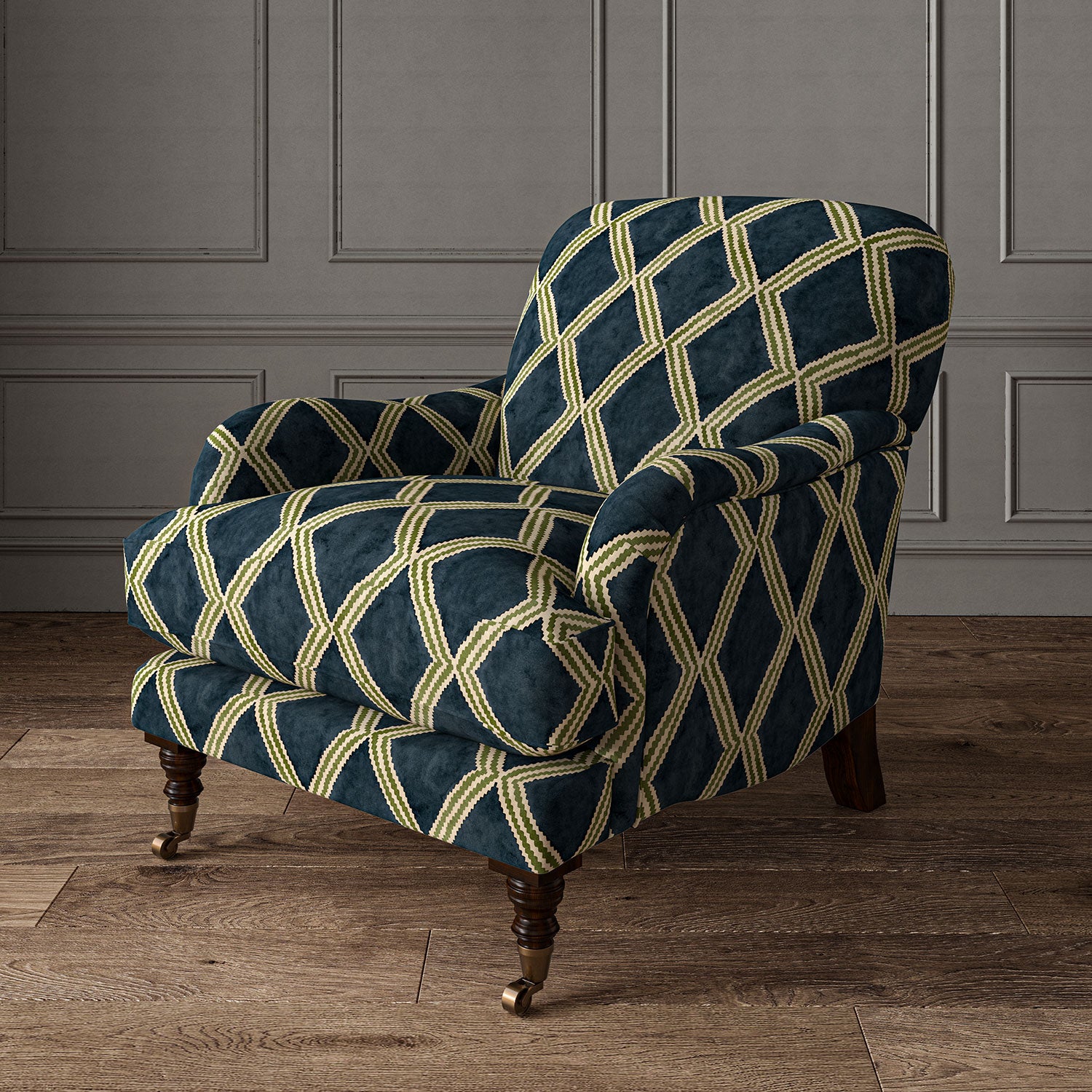 Accent chair upholstered in blue and green printed velvet with an irregular diamond pattern, showcasing the fabric’s rich texture. 
