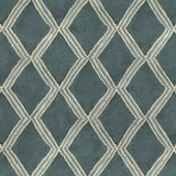 Close-up of blue printed velvet fabric featuring an irregular diamond motif with a soft, luxurious pile. 