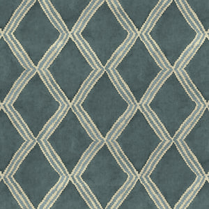 Close-up of blue printed velvet fabric featuring an irregular diamond motif with a soft, luxurious pile. 