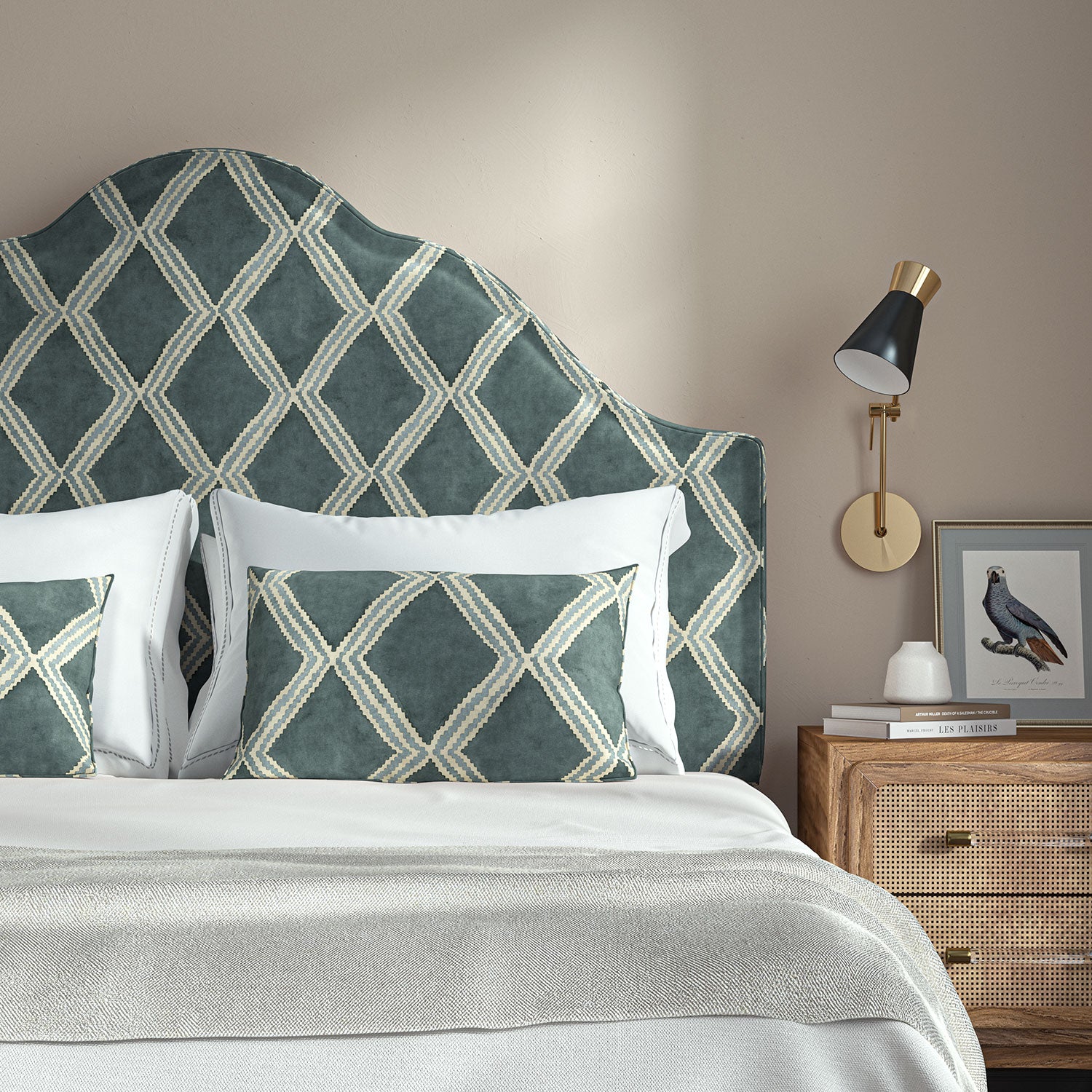 Bedroom with a curved upholstered headboard covered in blue printed velvet featuring an irregular diamond motif.