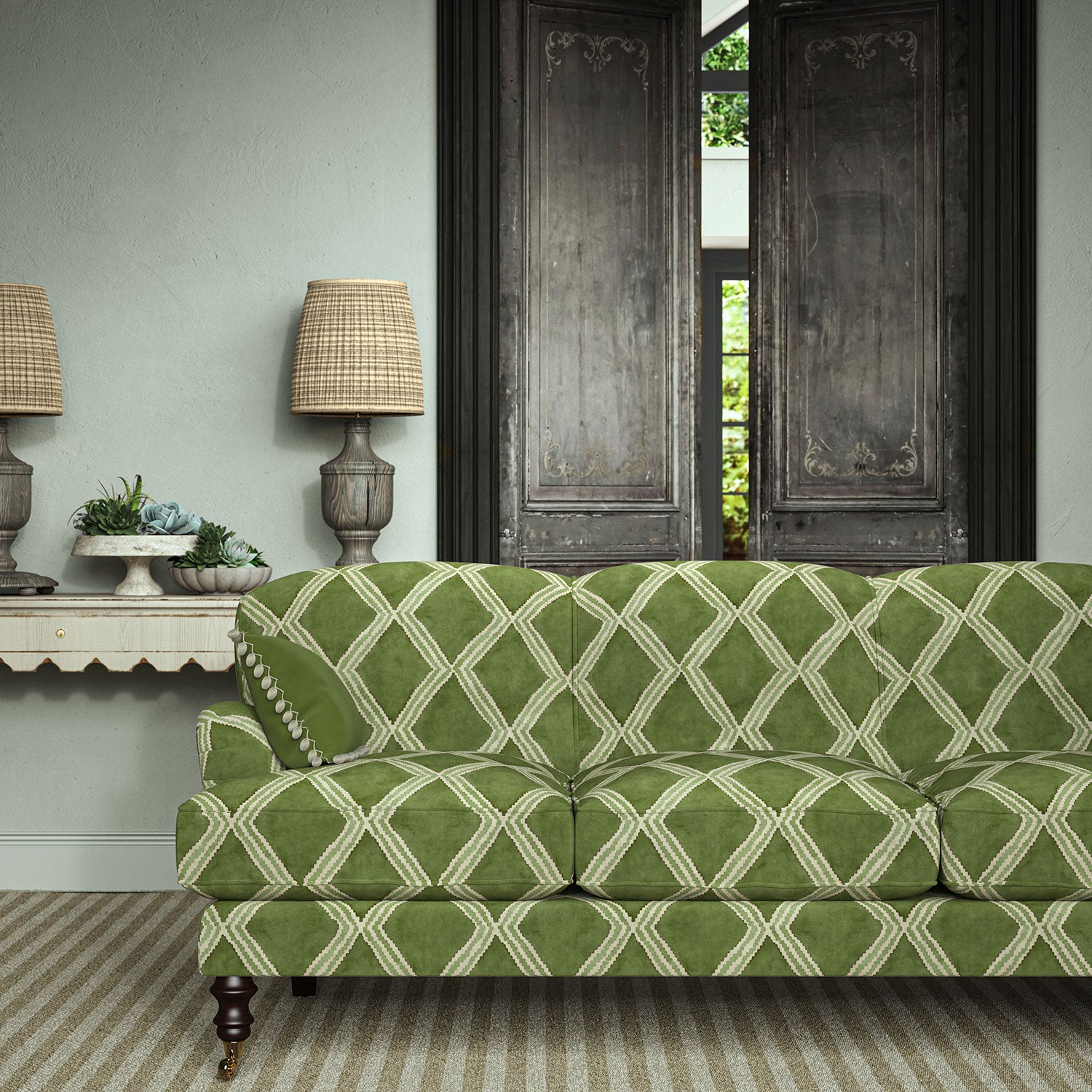 Sofa upholstered in green printed velvet featuring an irregular diamond motif, styled in a timeless living room.