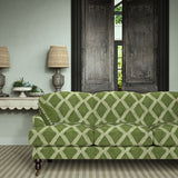 Sofa upholstered in green printed velvet featuring an irregular diamond motif, styled in a timeless living room.