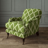 Accent chair upholstered in green printed velvet with an irregular diamond pattern, showcasing the fabric’s rich texture. 