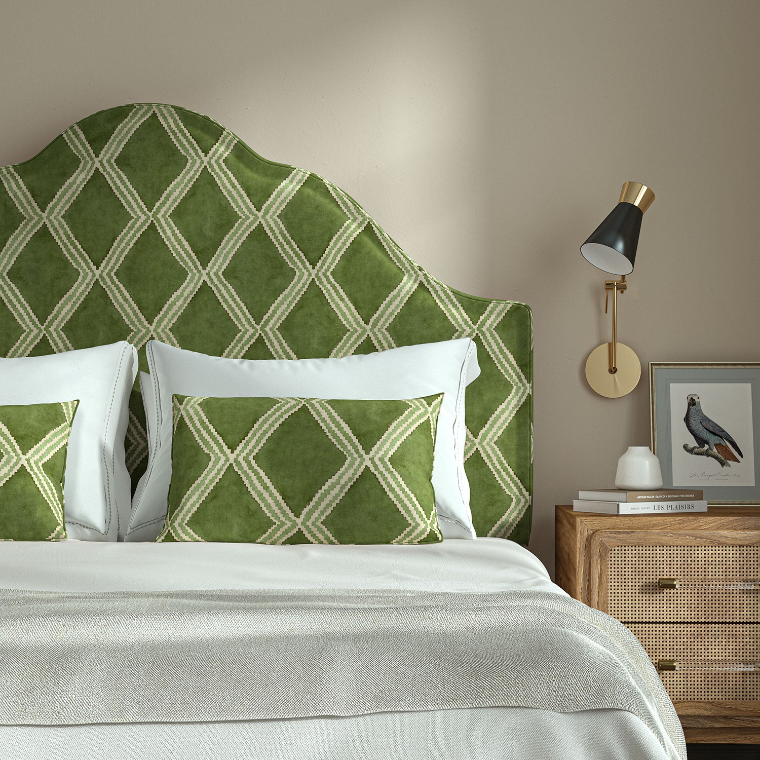 Bedroom with a curved upholstered headboard covered in green printed velvet featuring an irregular diamond motif.