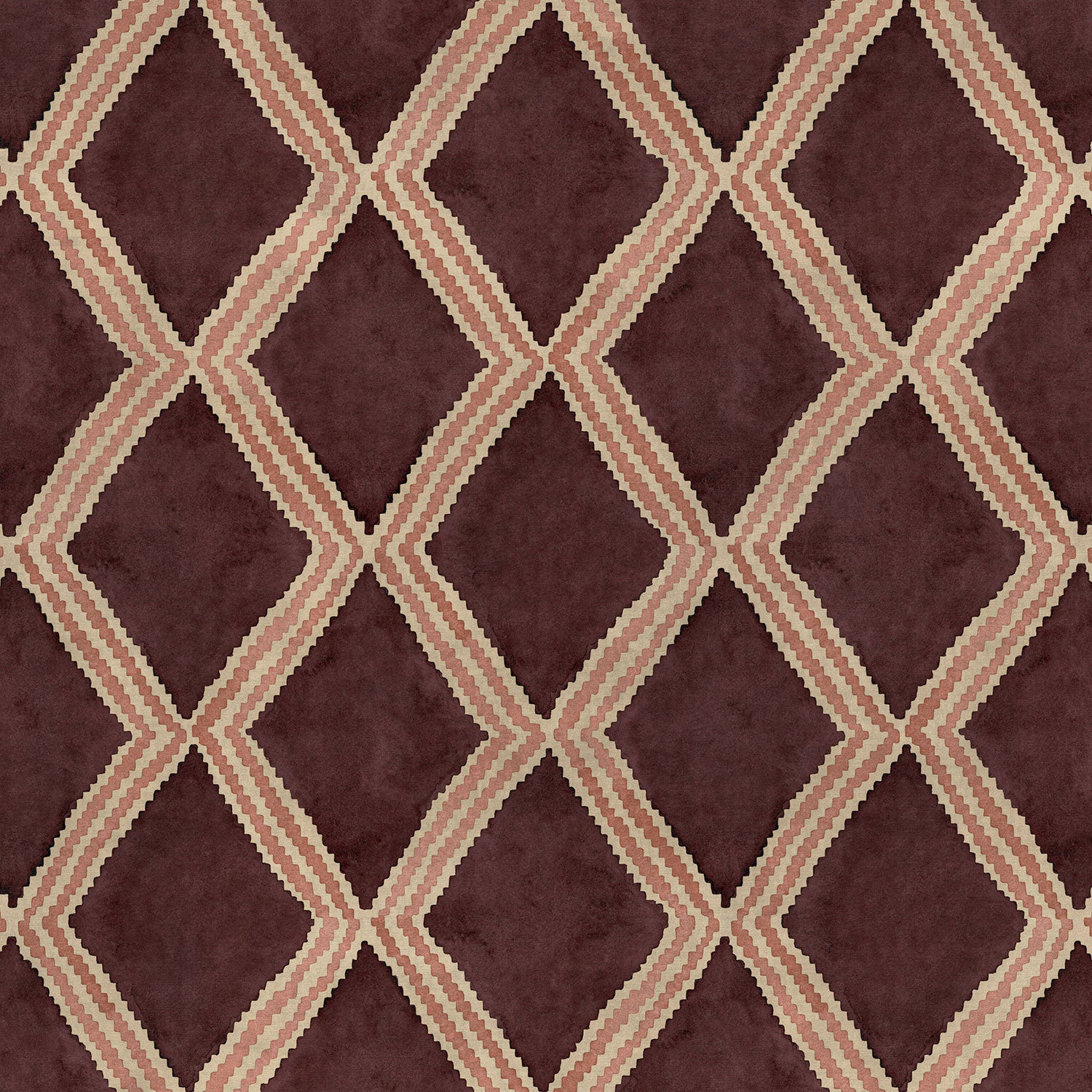 Close-up of maroon and pink printed velvet fabric featuring an irregular diamond motif with a soft, luxurious pile. 