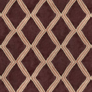 Close-up of maroon and pink printed velvet fabric featuring an irregular diamond motif with a soft, luxurious pile. 