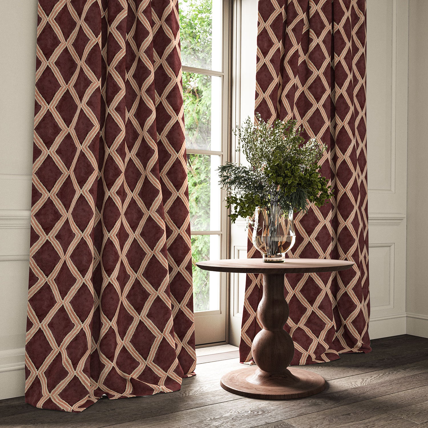 Maroon and pink printed velvet curtains with an irregular diamond pattern framing a tall window.