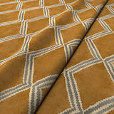Close-up of brown and blue printed velvet fabric featuring an irregular diamond motif with a soft, luxurious pile. 