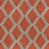 Close-up of orange and blue printed velvet fabric featuring an irregular diamond motif with a soft, luxurious pile. 