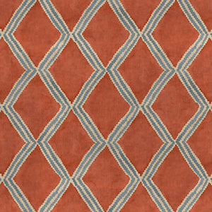 Close-up of orange and blue printed velvet fabric featuring an irregular diamond motif with a soft, luxurious pile. 