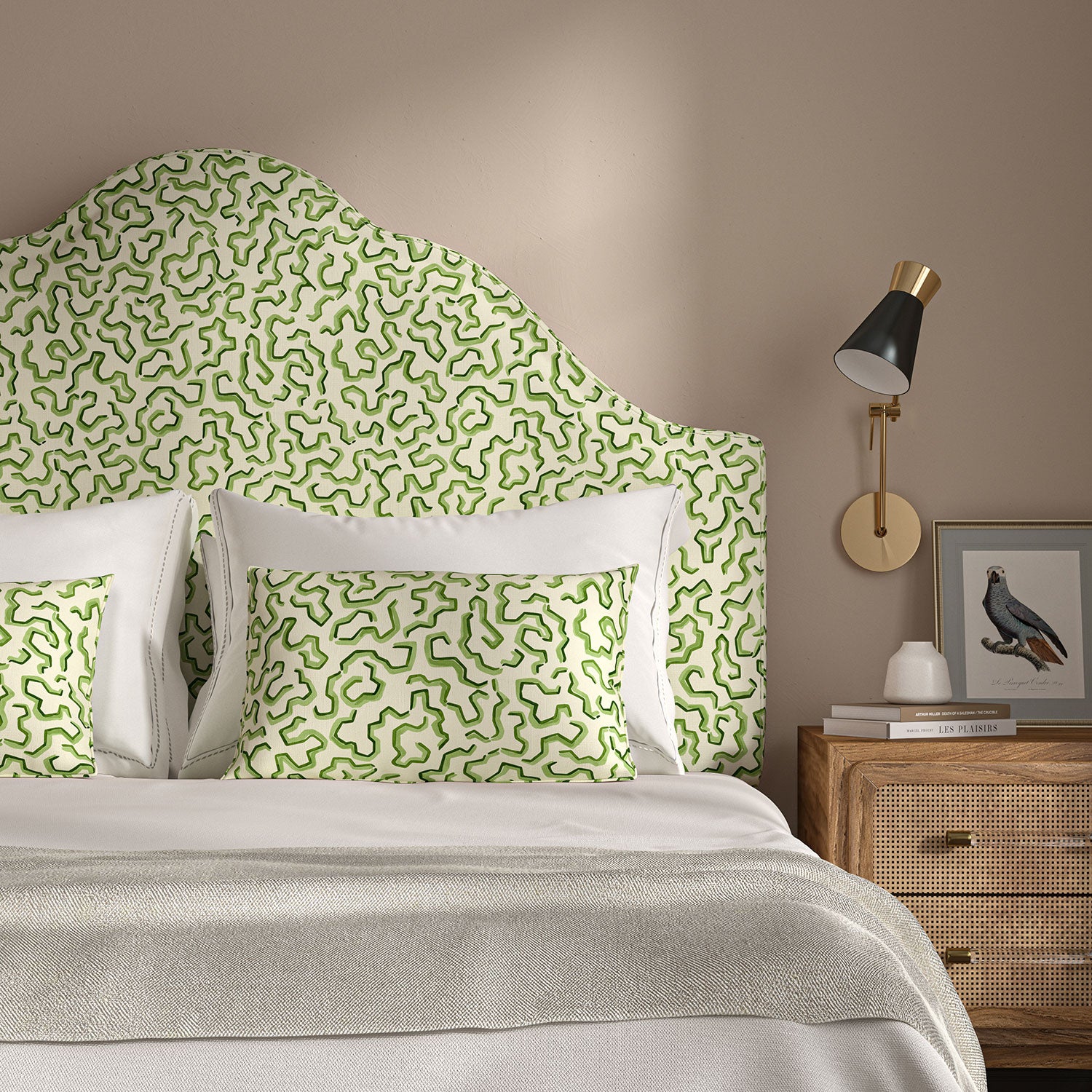 Headboard upholstered in a printed linen fabric in green and off white featuring a feel of a classic animal print.
