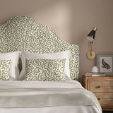 Headboard upholstered in a printed linen fabric in black, grey, and off white featuring a feel of a classic animal print.
