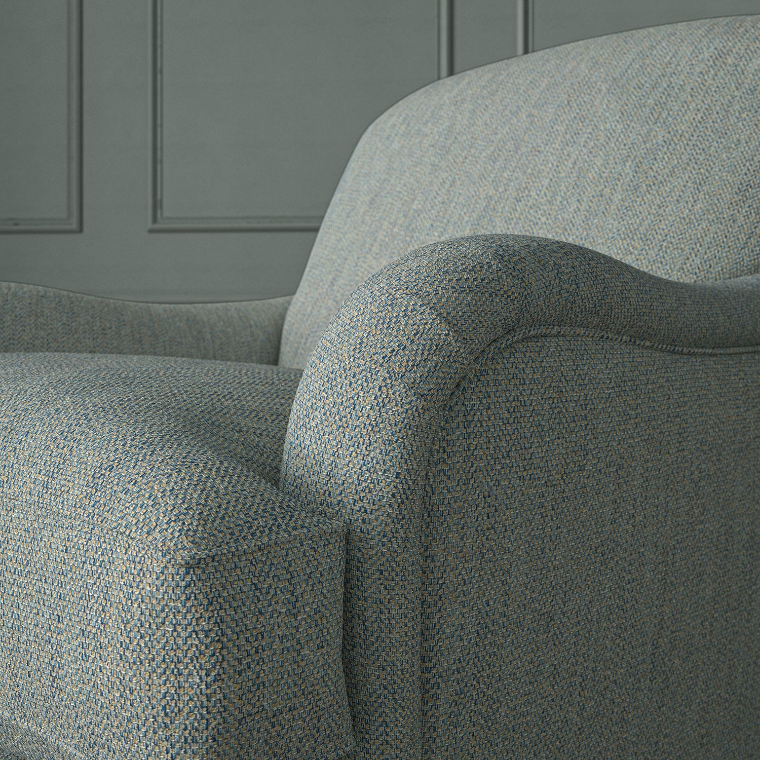 Close up of armchair in Loxley Bluestone by Linwood – durable, Italian-woven natural fibre fabric in muted blue.