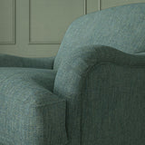 Close up of armchair in Loxley Cerulean by Linwood – durable, Italian-woven natural fibre fabric in blue.