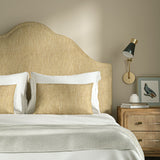 Upholstered headboard in Loxley Cornsilk by Linwood – Italian-woven yellow weave.
