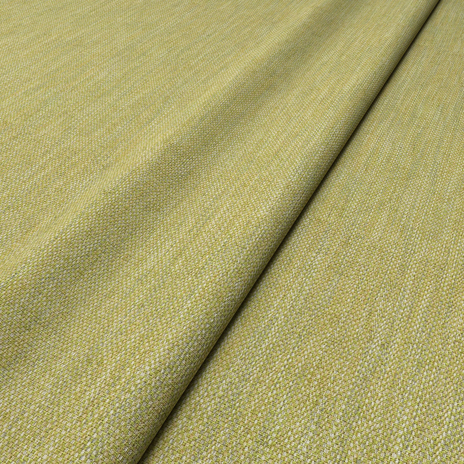 Close-up of Linwood’s Loxley Lime fabric – textured Italian weave in fresh green for upholstery.