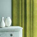 Curtain in Loxley Pistachio by Linwood – green Italian-woven fabric with rich texture and depth.